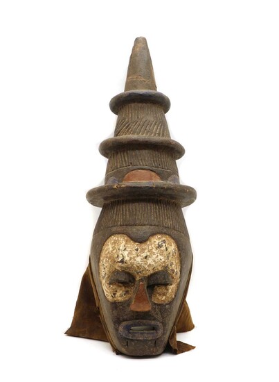 A North African carved and painted wooden mask