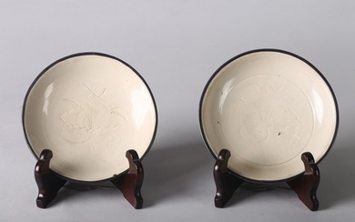 A PAIR OF CHINESE DING WARE CARVED LOTUS DISHES