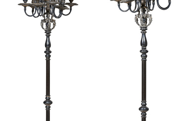 A PAIR OF RENAISSANCE-STYLE SILVERED-METAL EIGHT-LIGHT TORCHERES ON MARBLE BASES...