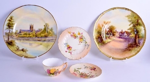 A ROYAL WORCESTER PLATE painted with a view of