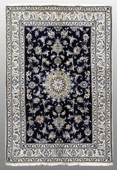 A RUG, Nain part silk, ca 216 x 144 cm.