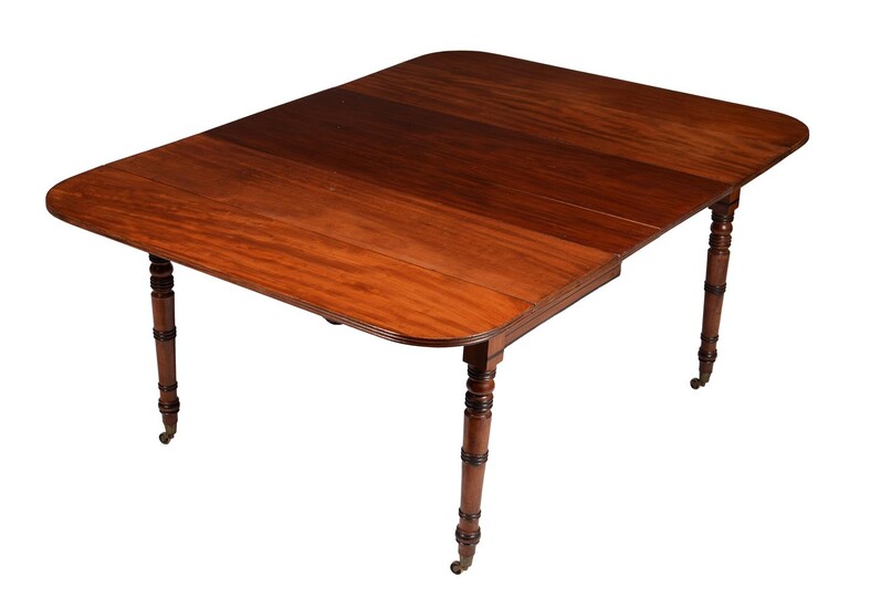 A Regency mahogany and ebonised extending dining table