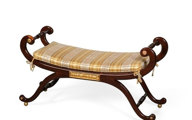 A Regency style gilt mahogany curule window bench
