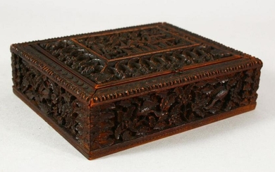 A SMALL EASTERN CARVED WOOD BOX, the interior with