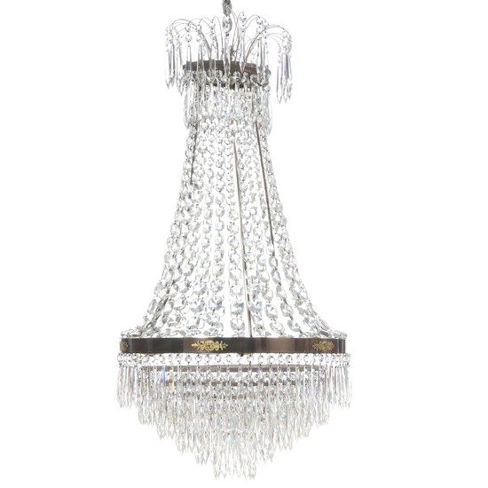 A Swedish Empire style crystal chandelier with brass frame. Electrical. Late 20th century. H. 90 cm. Diam. 52 cm.