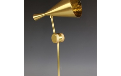 A Tom Dixon, London, 'Beat' brass desk lamp, the cone shaped...