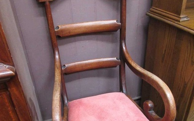 A Victorian mahogany open arm commode chairCondition Report There is...