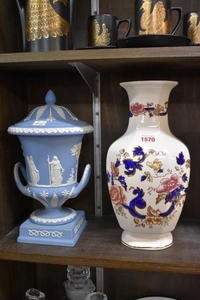 A Wedgwood pale blue jasperware twin handled urn and cover, ...