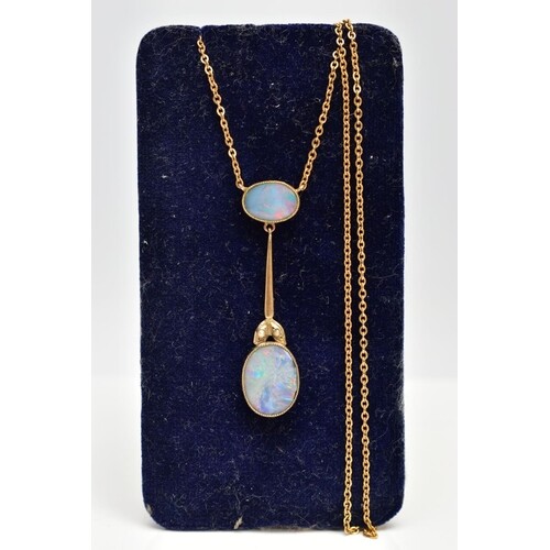 A YELLOW METAL OPAL PENDANT NECKLACE, the pendant designed w...