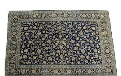 A blue wool Kashan carpet