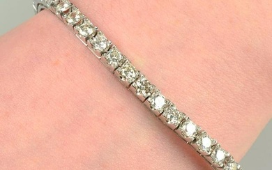 A brilliant-cut diamond line bracelet. Estimated total diamond weight 5.25cts, G-tinted colour