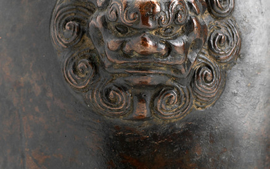 A bronze vase on integral stand