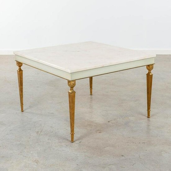 A coffee table made in Hollywood Regency style, brass
