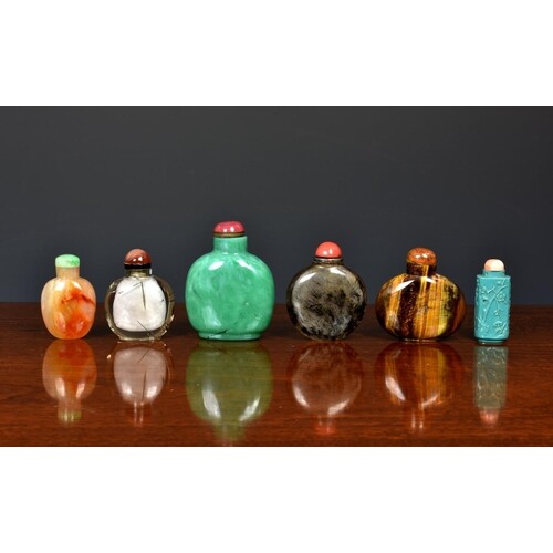 A collection of Chinese rock crystal and stone snuff bottles...