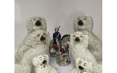 A collection of Victorian and later Staffordshire dogs of gr...