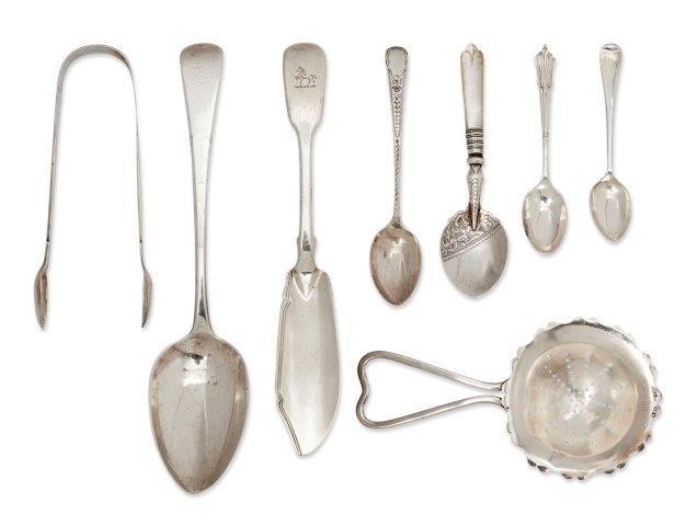 A collection of silver flatware, including six...