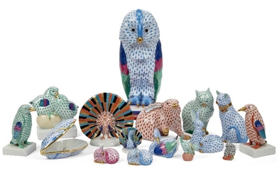 A collection of sixteen Herend porcelain figures, late 20th/21st century, printed blue marks to underside, decorated in scale pattern in various colour ways, to include a large figure of an owl standing on a pile of books, 28.5cm high; a peacock in...