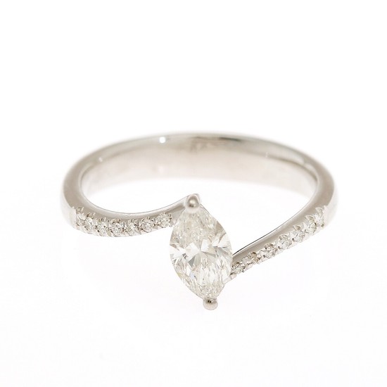 A diamond ring set with a marquise-cut diamond flanked by numerous brilliant-cut diamonds, mounted in 14k white gold. Size 53.