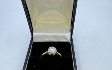 A diamond solitaire ring set with a calculated 0.80 carat...