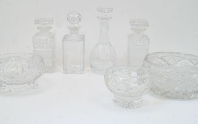 A group of cut glass bowls and decanters, 20th century, to include: a bulb shaped decanter with elongated neck and flat base, with stopper, 27cm high; two rectangular decanters with diamond moulded band to the body and rectangular stoppers, 22cm...