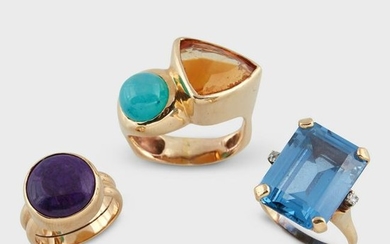 A group of three gem-set fourteen karat gold rings