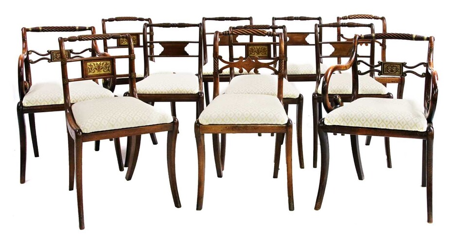 A harlequin set of eleven George III mahogany dining chairs