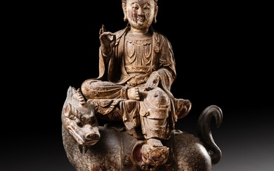 A large carved wood bodhisattva on a qilin, Ming dynasty | 明 木雕菩薩坐像