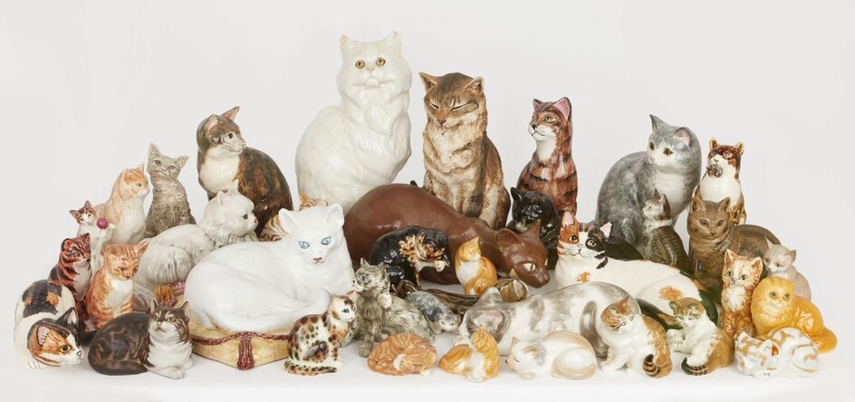 A large collection of pottery cats, to include a Wedgwood ginger cat, hand-painted with factory stamp to base, 16.5cm, a Lladro ceramic model of a crouching Siamese cat designed by Juan Huerta, with factory stamp to base and additional incised...