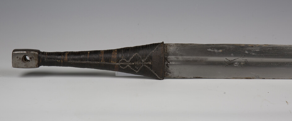 A late 19th century Omani katara with double-edged single-fullered blade, blade length 86cm, with et