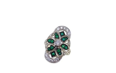 A modern emerald and diamond panel ring