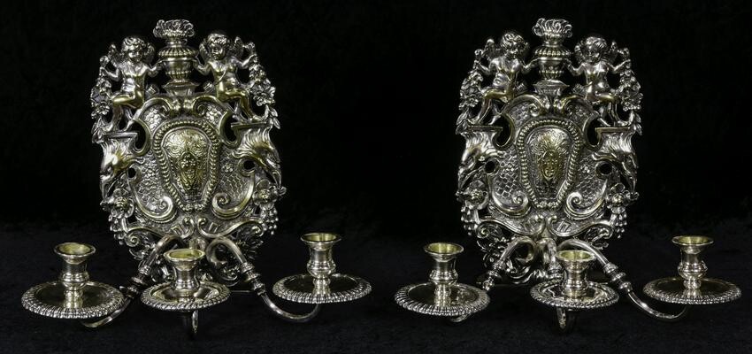 A pair Louis XV style silver plate three light wall