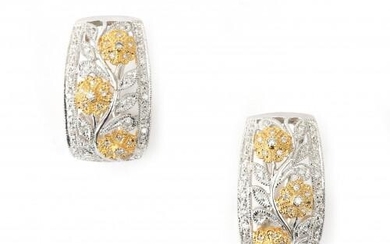 A pair of 18 karat two tone gold diamond earrings. Featuring a flower motif set with brilliant cut diamonds, ca. 1 ct. French fitting. Gross weight: 10.8 g.