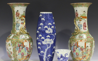 A pair of Chinese Canton famille rose porcelain vases, mid to late 19th century, each typically pain