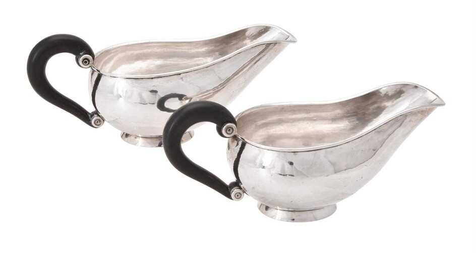 A pair of Danish silver coloured oval sauce boats by C. Holm