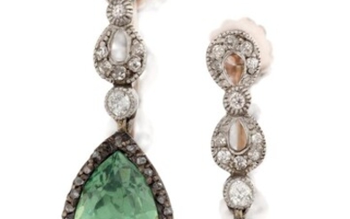 A pair of Edwardian diamond and tourmaline drop earrings, each in the form of a single pear-cut green tourmaline drop with rose-cut diamond border, suspended from millegrain-set old-brilliant-cut diamond figure of eight design clusters, c.1905...