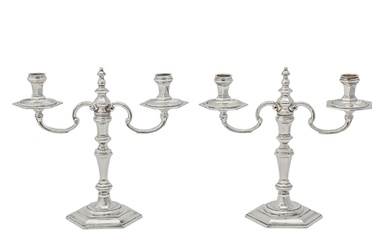 A pair of Elizabeth II silver candelabra, of hexagonal shape...