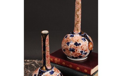 A pair of Japanese porcelain bottle vases, decorated in the ...