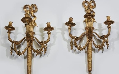A pair of Louis XVI style gilt-bronze three-light