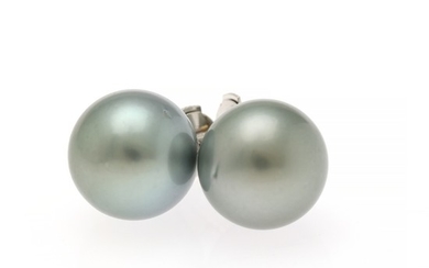A pair of Tahiti pearl ear studs each set with a cultured Tahiti pearl, mounted in 14k white gold. Diam. app. 12.7 mm. (2)