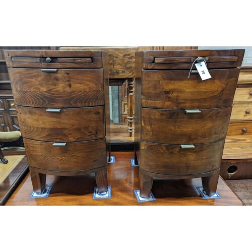 A pair of contemporary bow front three drawer bedside chests...