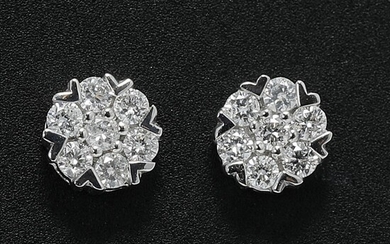 SOLD. A pair of diamond ear studs each set with seven brilliant-cut diamonds weighing a total of app. 0.16 ct., mounted in 18k white gold. Diam. app. 4.6 mm. (2) – Bruun Rasmussen Auctioneers of Fine Art