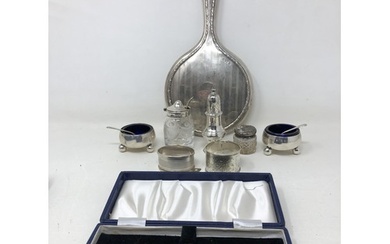 A pair of silver salts, a pepper pot, two napkin rings, a fo...