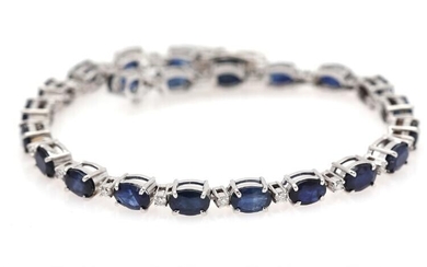 SOLD. A sapphire and diamond bracelet set with numerous sapphires weighing a total of app. 13.14 ct. and numerous diamonds, mounted in 14k white gold. L. app. 18.5 cm – Bruun Rasmussen Auctioneers of Fine Art