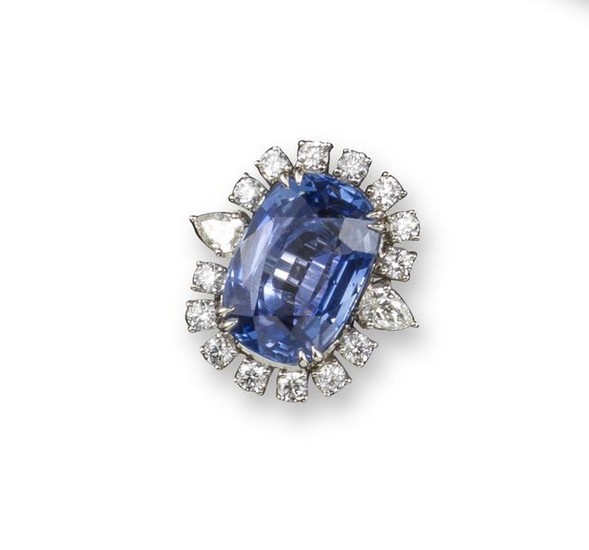 A sapphire and diamond cluster ring, the cushion-shaped...