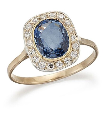 A sapphire and diamond cluster ring, the oval...