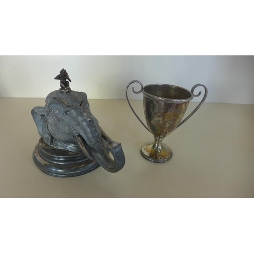 A silver plated desk inkwell in a the form of an elephants h...