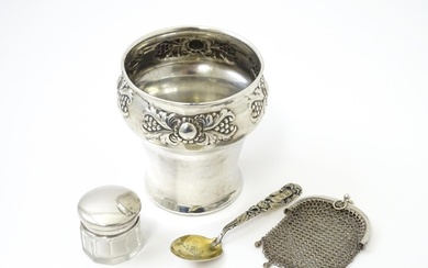 A silver pot of tapering form with embossed decoration, hall...