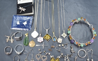 A small selection of silver and white metal jewellery including pendants including Milenium &
