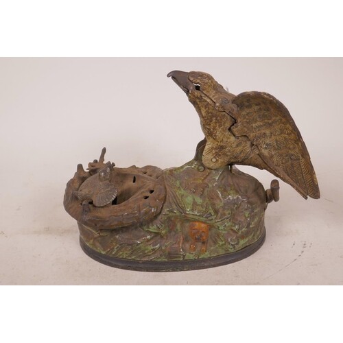 A vintage American cast iron eagle and eaglette mechanical m...