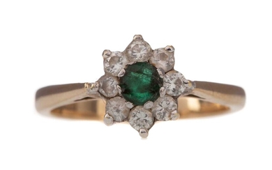 AN EMERALD AND PARTIAL DIAMOND RING